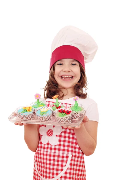 Menina cozinheiro com muffin flor primavera — Fotografia de Stock