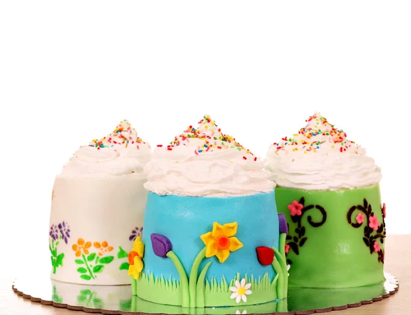 Three sweet cupcakes on table — Stock Photo, Image