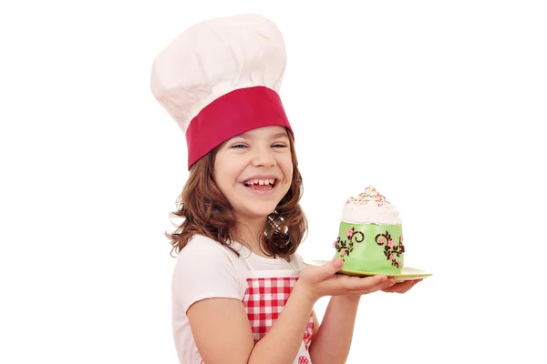 Happy little girl cook with cupcakes — Stock Photo, Image