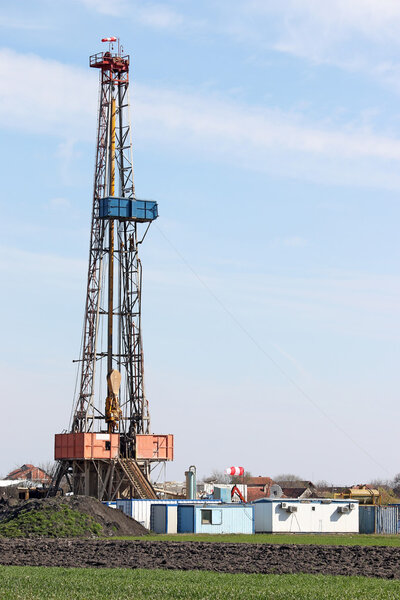 land oil drilling rig on oilfield