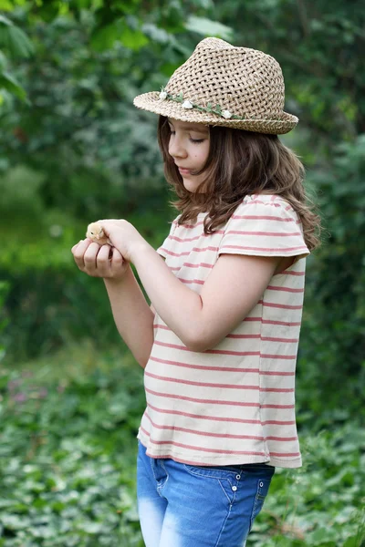 Little girl holding cute small chicken — Stock Photo, Image