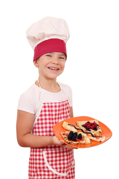 Felice bambina cuoca con crepes — Foto Stock