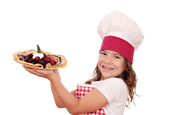 Happy little girl cook with crepes — Stock Photo, Image