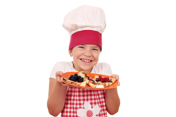 Happy little girl cook with delicious crepes — Stock Photo, Image