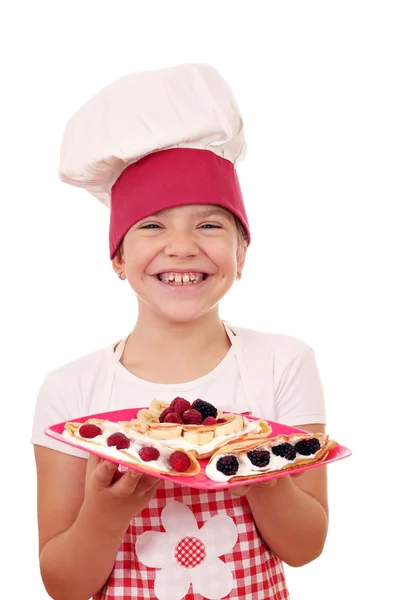 Happy little girl cook with crepes — Stock Photo, Image