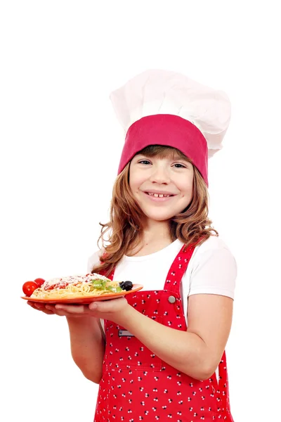 Happy little girl cook with spaghetti on plate — Stock Photo, Image