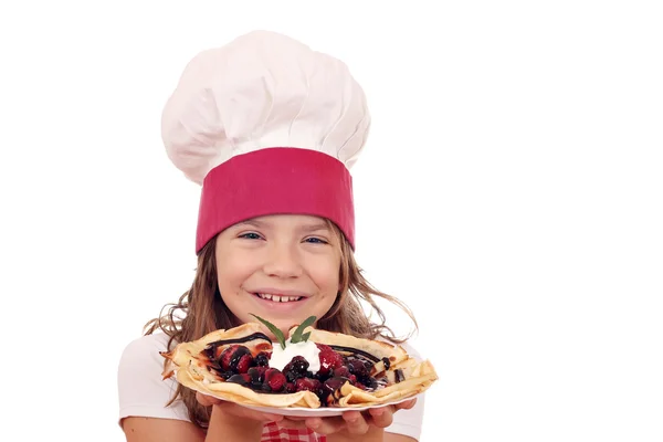 Happy little girl cook with sweet crepes portrait — Stock Photo, Image