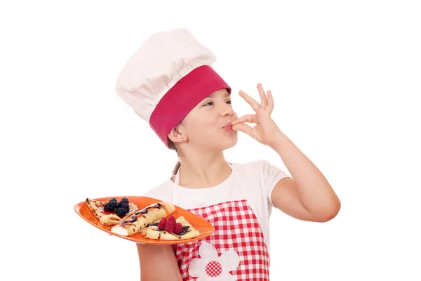 Little girl cook with sweet crepes and ok hand sign — Stock Photo, Image