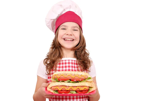 Happy little girl cook with hot dogs — Stock Photo, Image