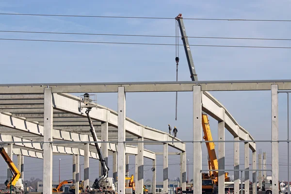 Construction site with workers and machinery — Stock Photo, Image