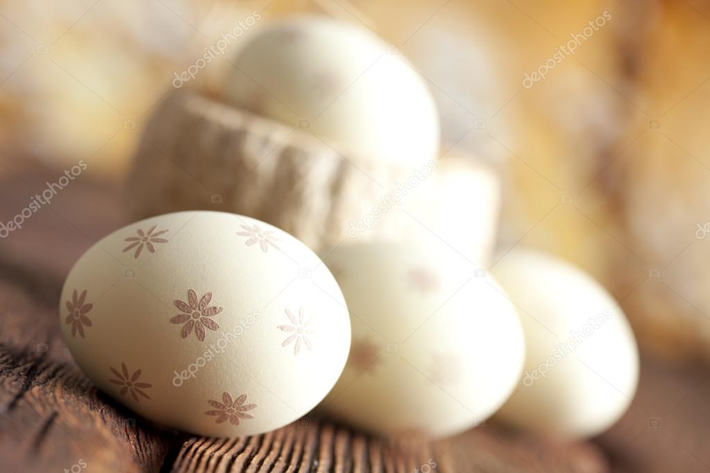 White Easter eggs on wooden table