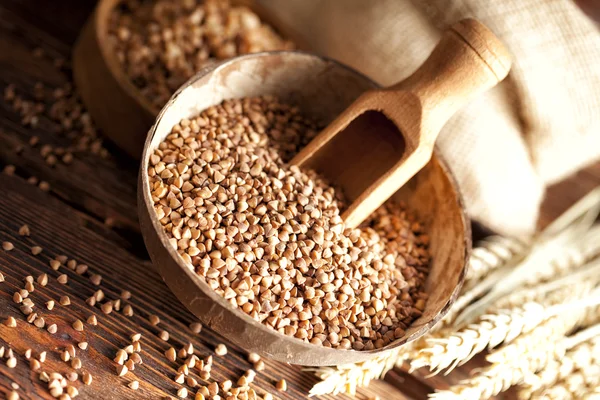 Buckwheat in wooden bowl — Stock Photo, Image