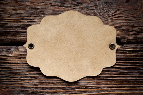 Etiqueta de papel na mesa de madeira — Fotografia de Stock