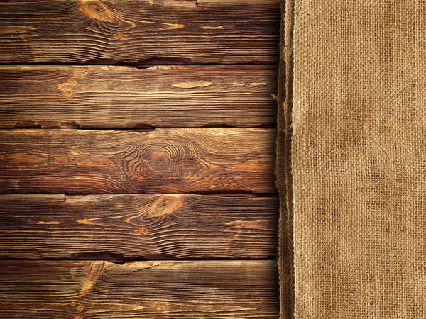 Wooden wall background and old canvas — Stock Photo, Image