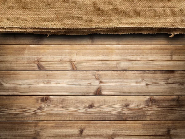 Hölzerne Wand Hintergrund und alte Leinwand — Stockfoto