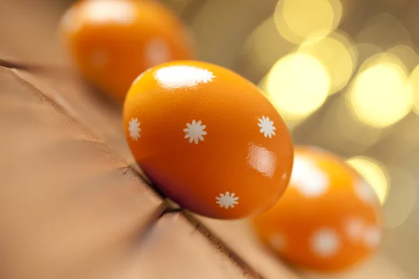 Three Easter eggs on wooden background — Stock Photo, Image