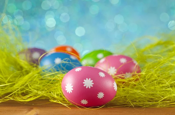 Colored Easter eggs on blue background — Stock Photo, Image