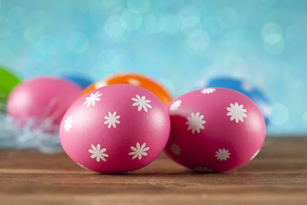 Colored Easter eggs on blue background — Stock Photo, Image