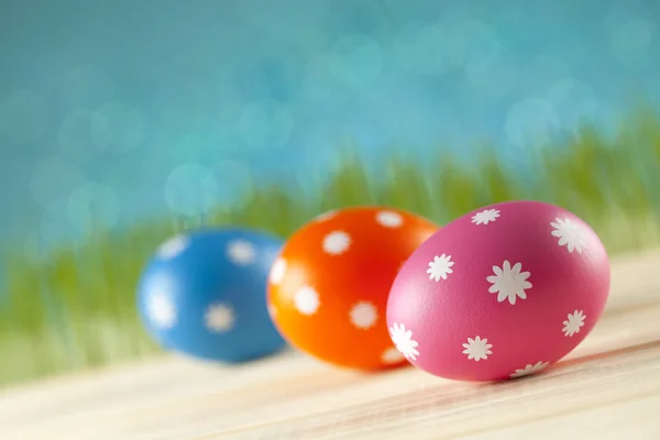 Colored Easter eggs on blue background Royalty Free Stock Images