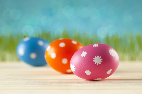 Colored Easter eggs on blue background — Stock Photo, Image