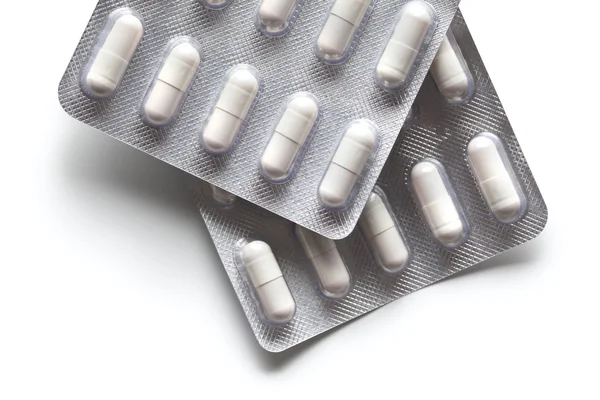 Medication - white capsules — Stock Photo, Image