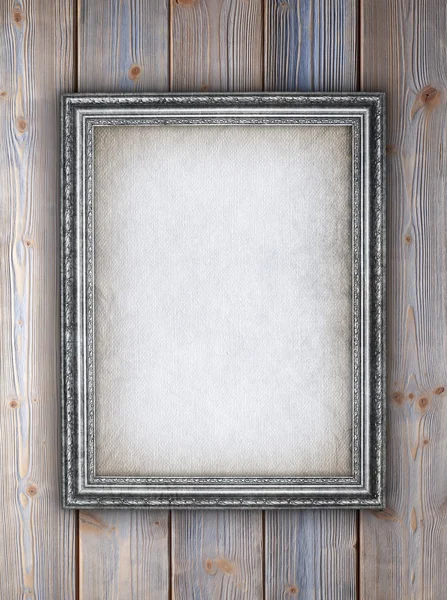 Decorative picture frame on wooden planks background — Stock Photo, Image