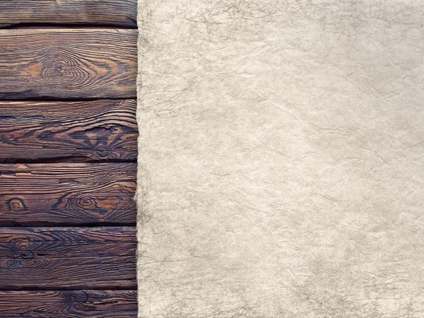 Handmade paper sheet on old wood plank wall background — Stock Photo, Image