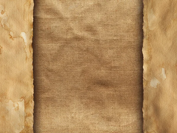 Old handmade paper sheet on creased fabric background — Stock Photo, Image