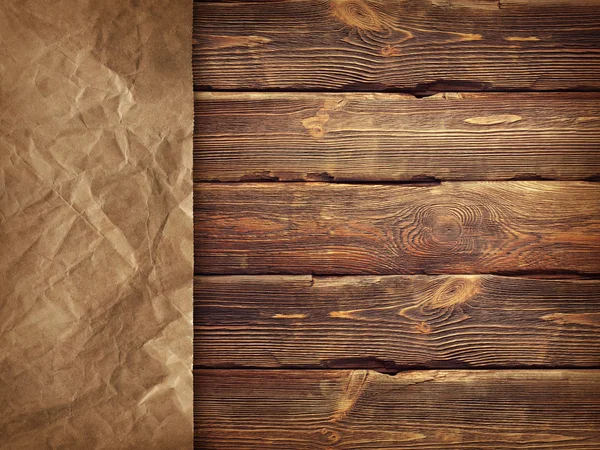 Creased handmade paper on wooden wall background — Stock Photo, Image