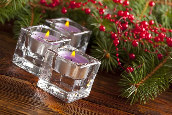 Candles and decorated branch of christmas tree — Stock Photo, Image