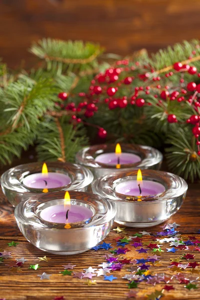Christmas lights - candles and branch of spruce tree — Stock Photo, Image