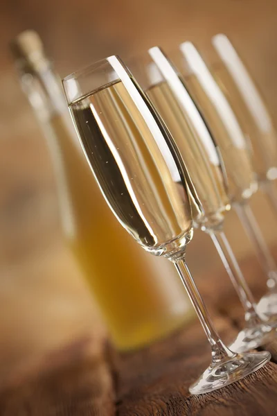 Glasses of champagne on brown background — Stock Photo, Image