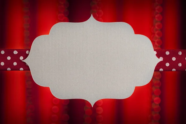Blank label and ribbon on red background — Stock Photo, Image