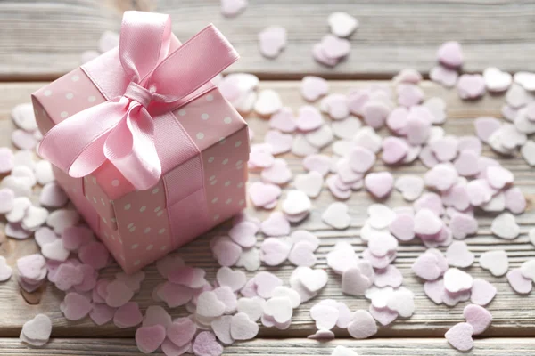 Pink gift box on abstract background — Stock Photo, Image