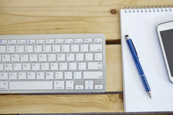 Office desk table with computer and smarthphone — Stock Photo, Image