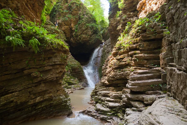 Young lady is near waterfall, Russia, Western Caucasus — Stock Photo, Image