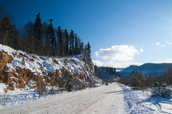 Cars are on winter mountain road in the of Adygea — Stock Image Cars are on winter mountain road in the of Adygea Stock Photo