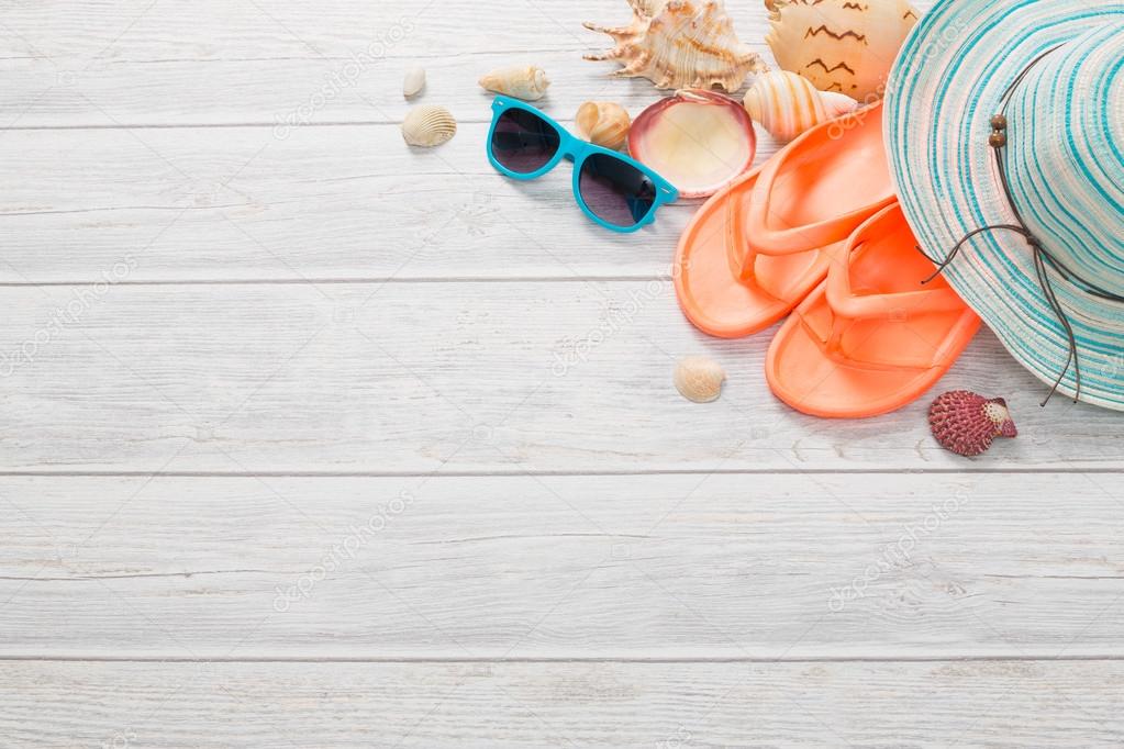 Beach accessories on wooden board.