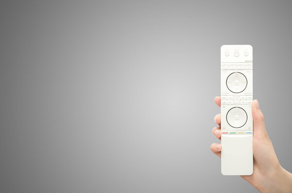 Hand with remote control.