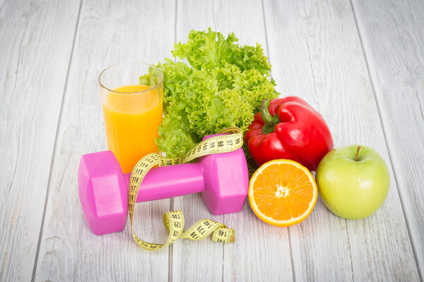 Fitness equipment and healthy food.