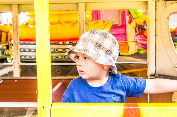 Boy on carousel — Stock Photo, Image