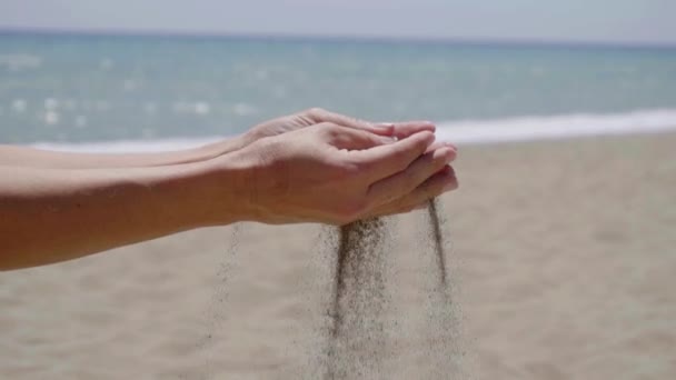 Stream of sand pouring from hands — Stockvideo