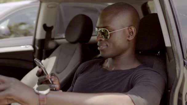 Man in luxury car using phone — Stock Video