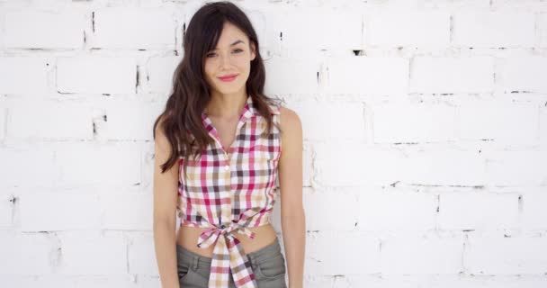 Attractive woman with checkered top and shorts — Stock Video