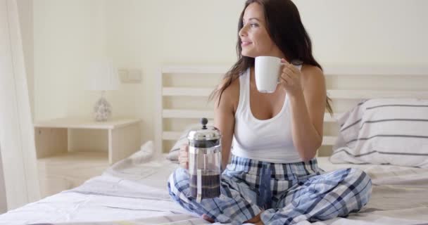 Young woman drinking a mug of fresh coffee — Wideo stockowe