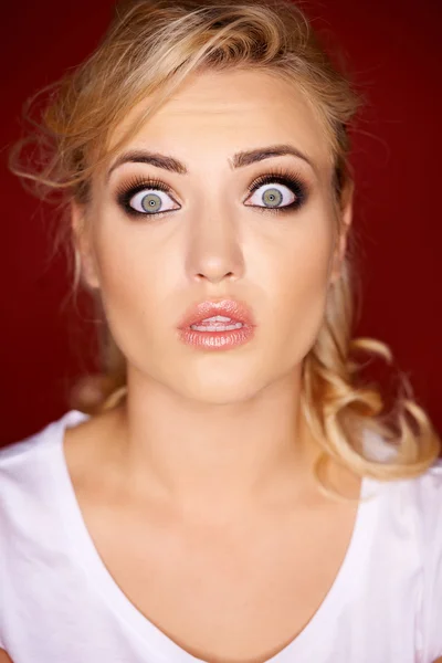 Beautiful woman with a horrified expression — Stock Photo, Image
