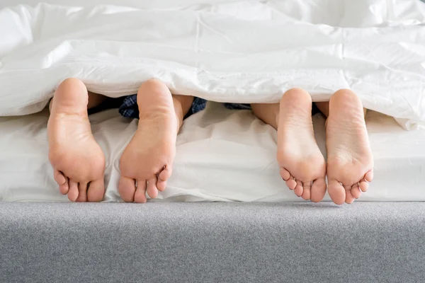 Sweet Couples Feet Soles on Bed — Stock Photo, Image