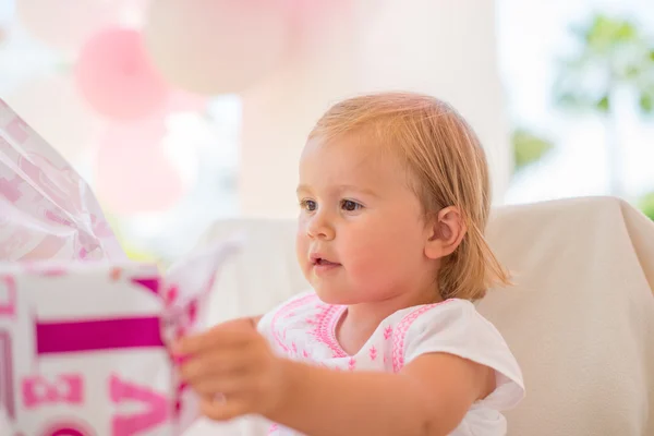 Excited Cutie Unwrapping Birthday Present — Stock Photo, Image