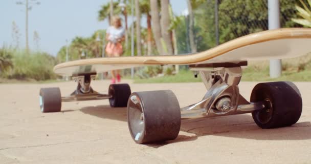 Longboard Resting on the Ground at the Street — Stock Video