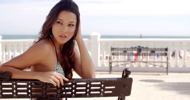 Pretty happy young woman relaxing at the seaside — 图库视频影像